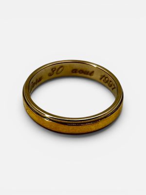 a close up of a gold wedding ring with the words ' i love you to the moon and back '
