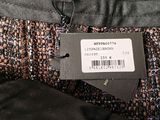 the label on the jacket is attached to the pants