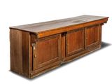 an image of a wooden cabinet with two doors on one side and a shelf on the other side