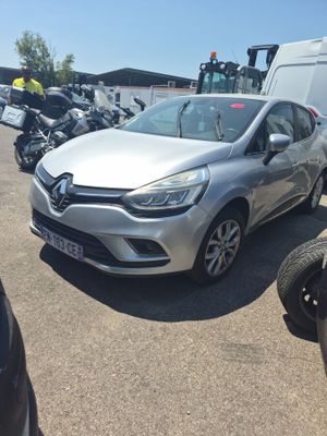 a silver car that is parked in a parking lot