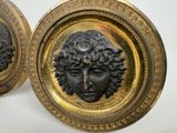 pair of antique brass plaques of a woman ' s face