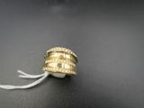 a close up of a ring on a string with a tag