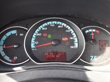 a close up of a speedometer in a car