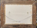 an old picture frame with a smiley face drawn on it