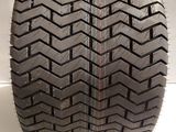 a close up of a tire on a white surface