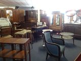 a room with a lot of furniture and a clock on the wall