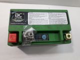 an image of a green battery box sitting on top of a white table