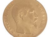 l'image d'une pièce d'or sur laquelle figure le visage d'un homme