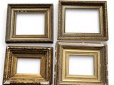 four antique gold picture frames on a white background