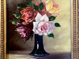 a painting of roses in a blue vase on a table