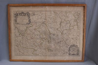 an old map of germany in a wooden frame on a blue background