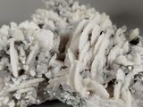 a close up of a piece of rock with some snow on top of it