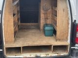 the back of a van with the door open showing the inside of it