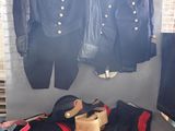 a display of military uniforms on display in a room