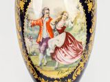 a vase with a picture of a man and a woman on it
