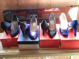 several pairs of women ' s shoes are on display in a display case