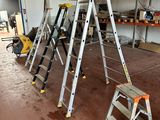 many ladders that are sitting in a room