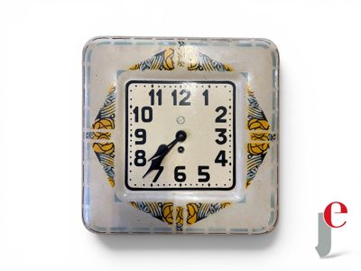 a clock that is sitting on the wall in front of a white background