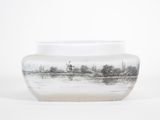 a glass vase with a picture of a deer in the water
