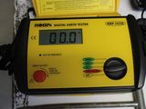 a digital earth tester sitting on top of a table