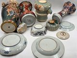 many different types of vases and plates on the table