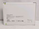 the back of a white box with a green label on it