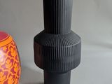 two vases sitting next to each other on a table