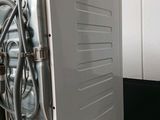an image of a washing machine in a bathroom