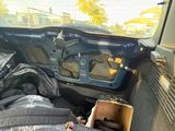 a box of luggage sitting in the back of a car