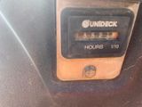 a close up of a clock on the side of a car
