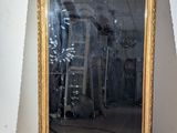a large mirror sitting on the floor in a room