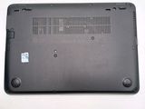 a black laptop with a small hole in the back