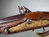 a close up of a gun that is on display