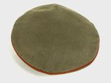 a green hat with a red band on it