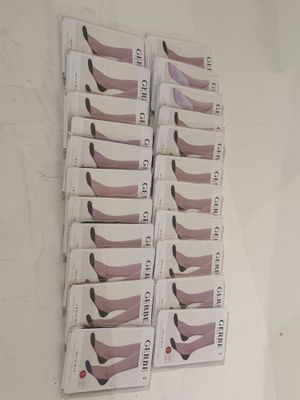 six pairs of shoes that are on display on the wall