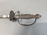 a sword that is sitting on top of a table