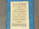 an old book with a blue cover sitting on top of a table