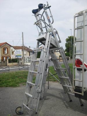 a ladder that is attached to the back of a truck