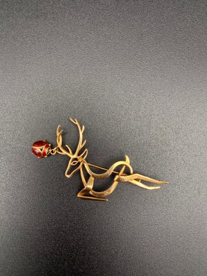 gold plated reindeer brooch with red glass bead and antlers