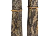 pair of marble pedestals with candles on top of them