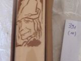 someone is holding a box with a baseball bat in it