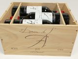 a wooden box with three bottles of wine in it