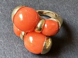 an image of a close up of an orange ring on a table