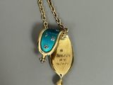 gold plated necklace with a blue glass pendant and a gold chain