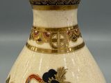 a white vase with a picture of a woman on it
