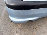 a close up of a car ' s bumper with a sticker on it