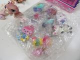 a bunch of little pony toys in a plastic bag