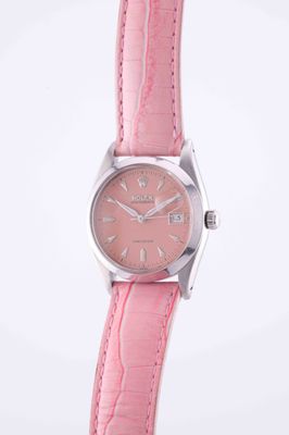 an image of a woman ' s watch with a pink leather strap