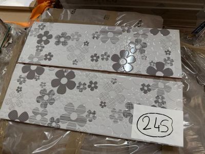 two pieces of paper that have been wrapped up on a table