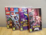 three nintendo wii games are sitting on a table next to each other
